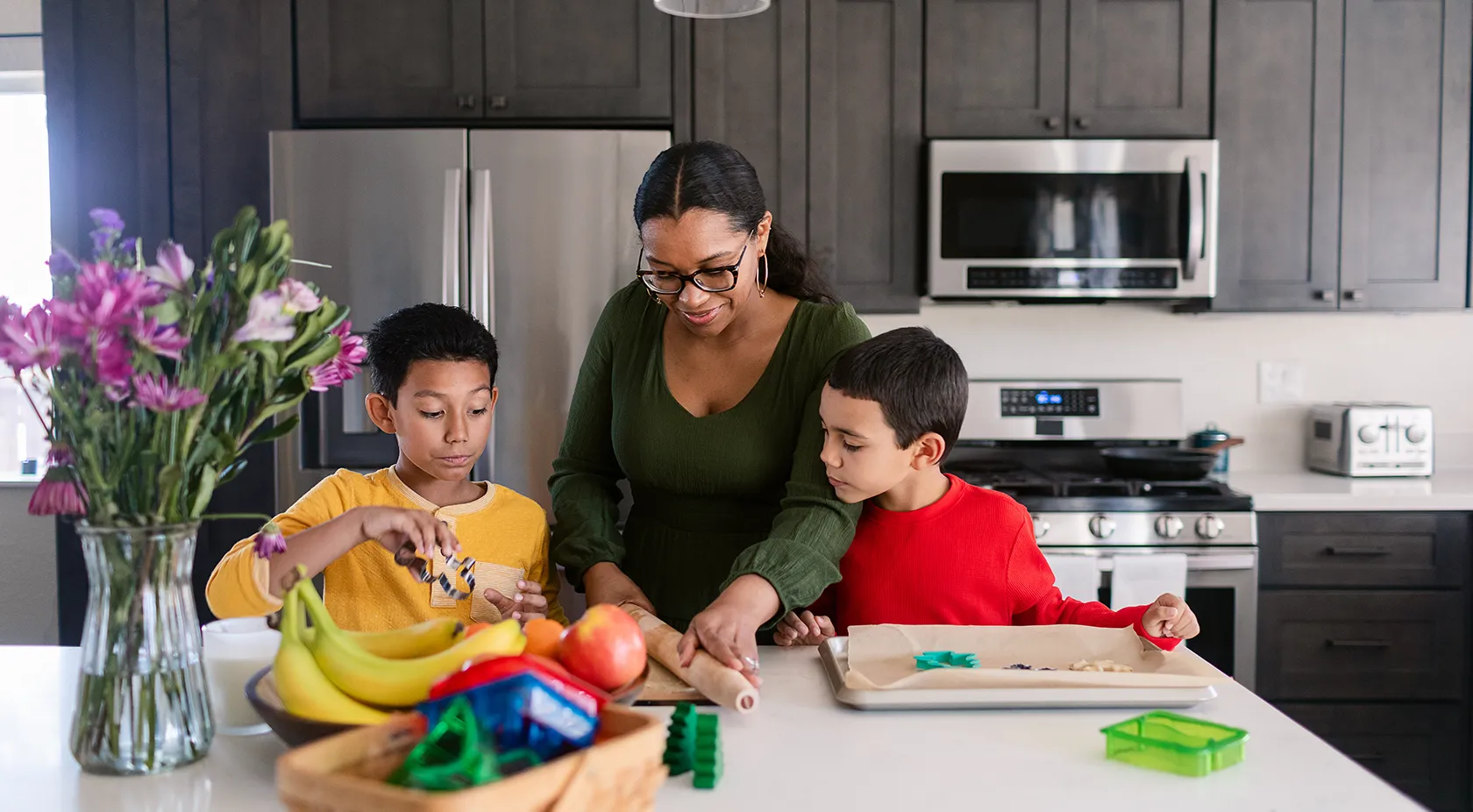 Mother cooking with her kids