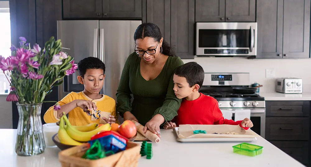 Mother cooking with her kids