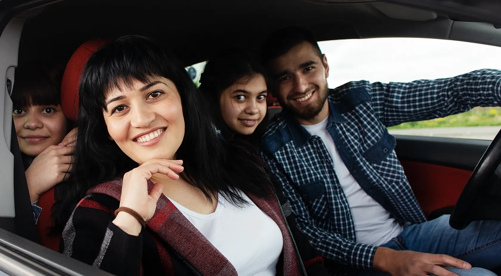 family in their car