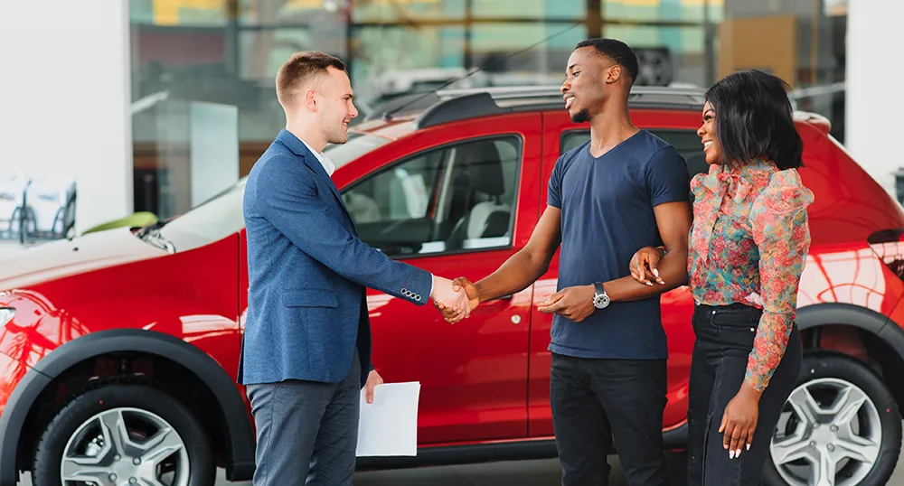 Couple buying their new car