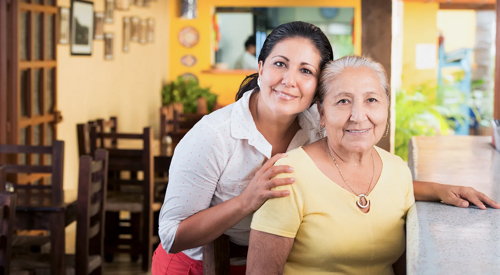 Mother and daughter in their restaurant