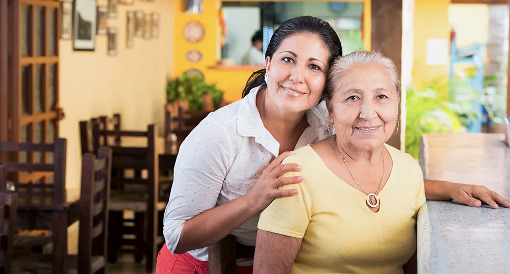 Mother and daughter in their restaurant