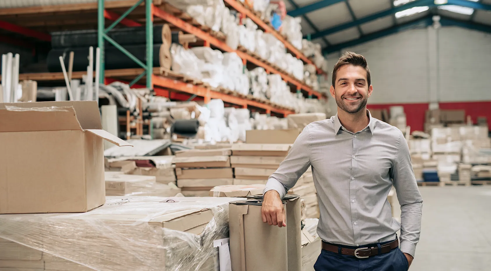 business owner standing in his warehouse
