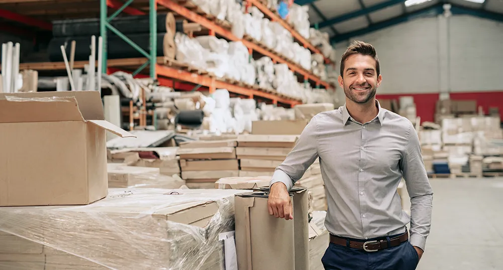 business owner standing in his warehouse