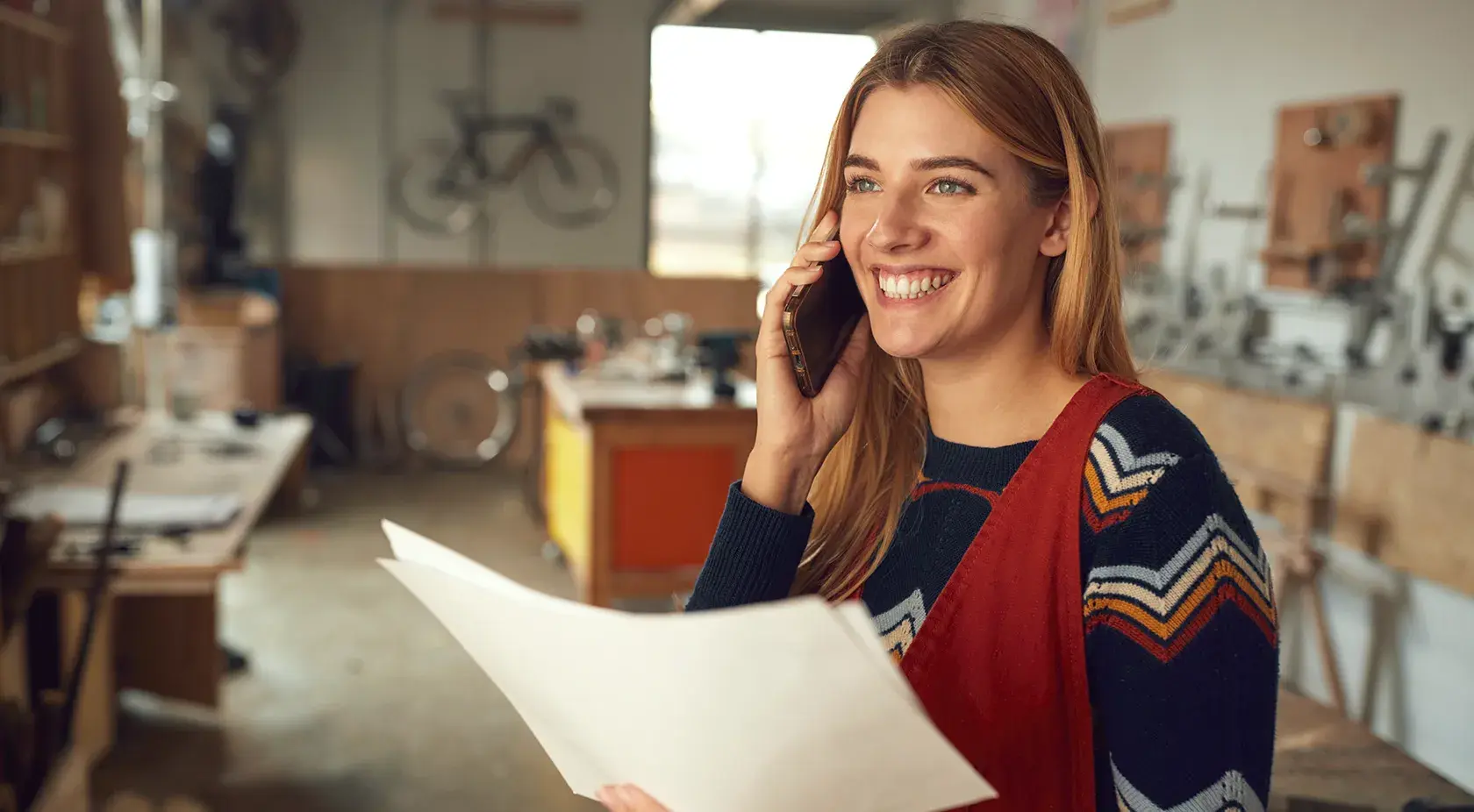 Lady on the phone reading a document