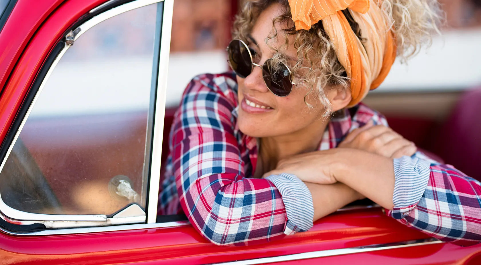 Lady leaning out of her car