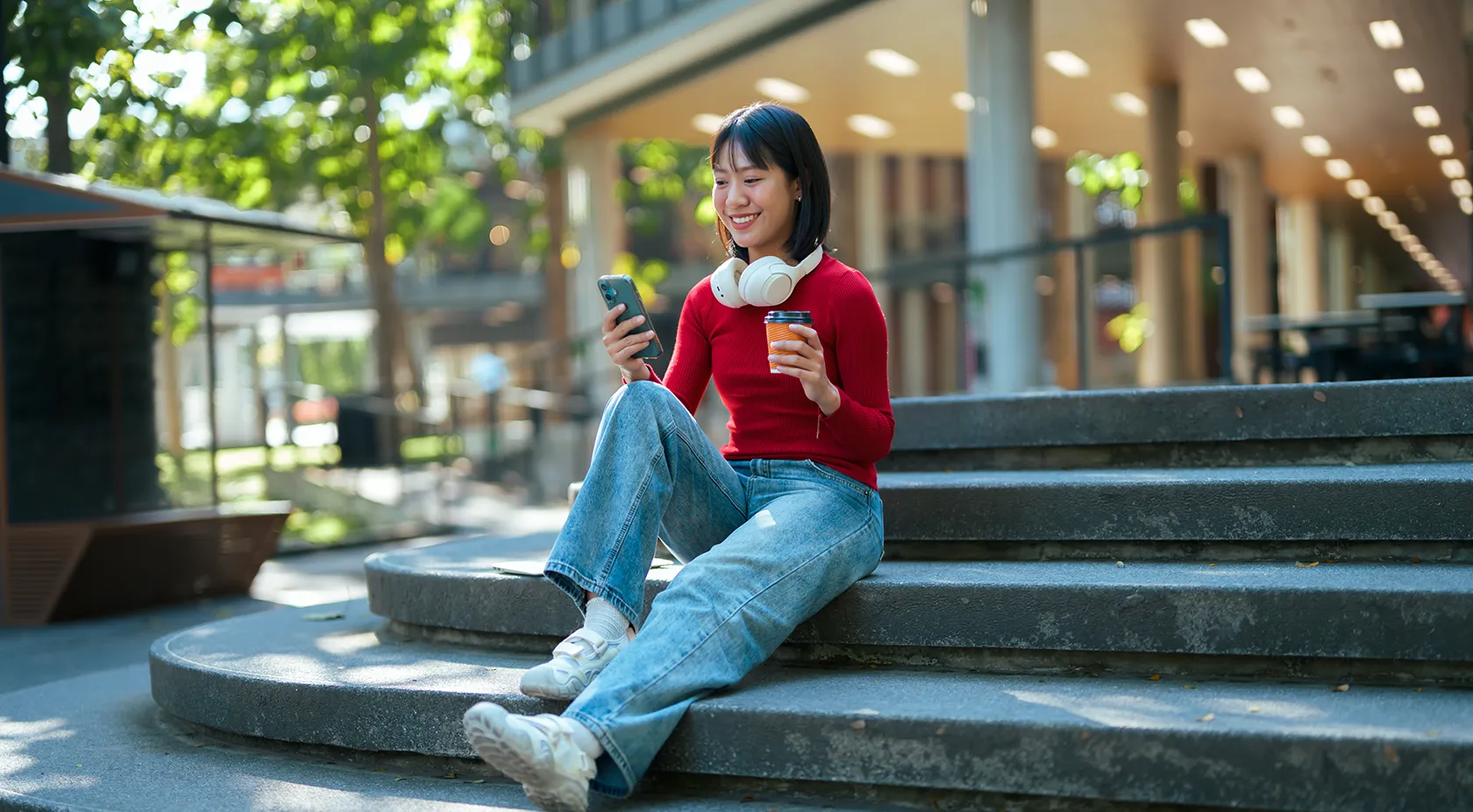 Student sitting on college steps