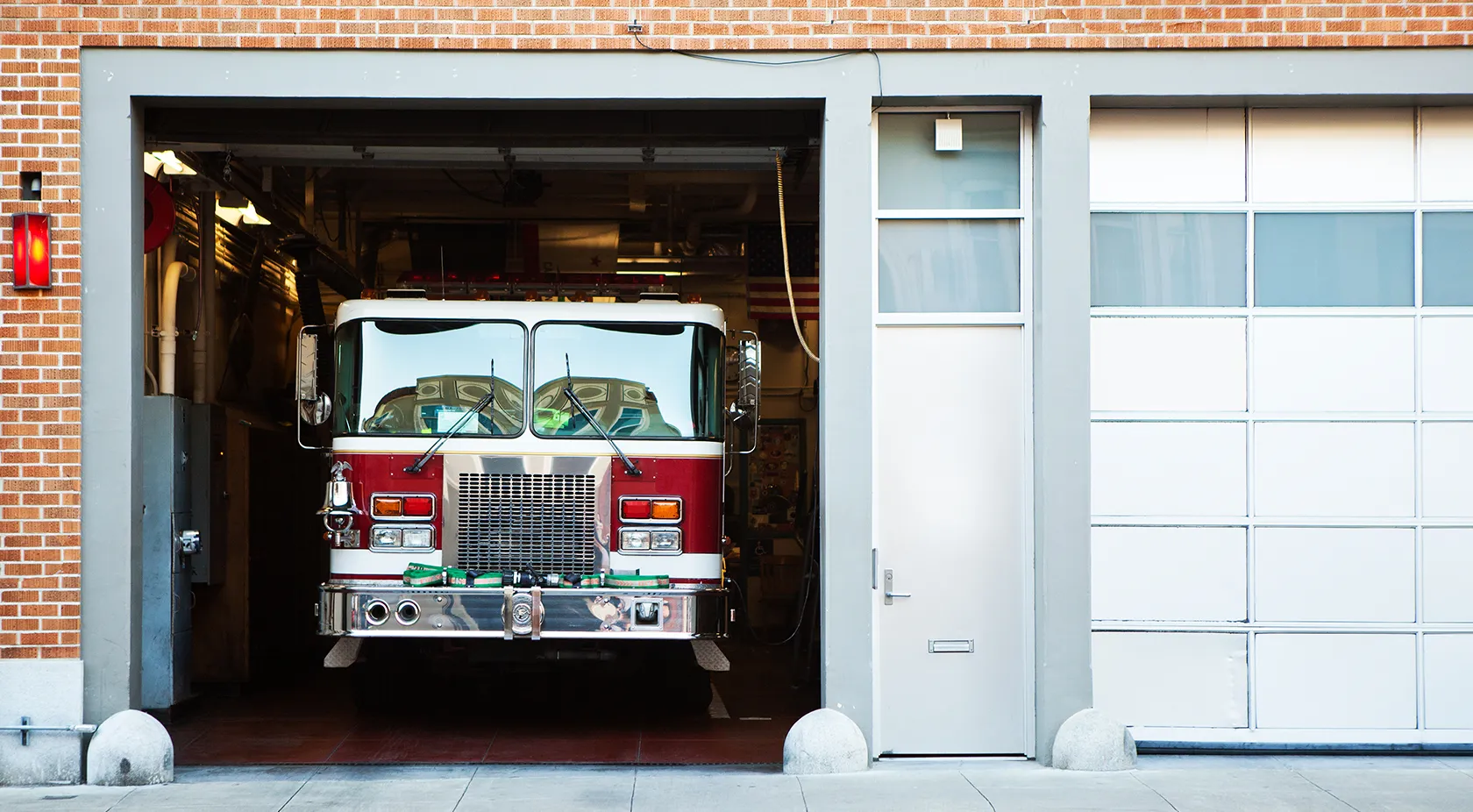 Fire engine in station with door open