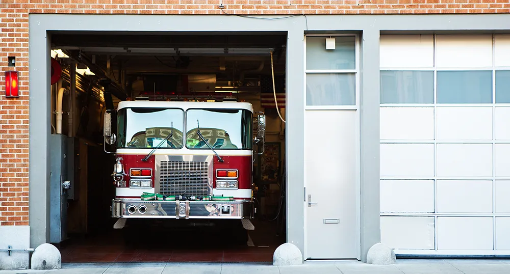 Fire engine in station with door open
