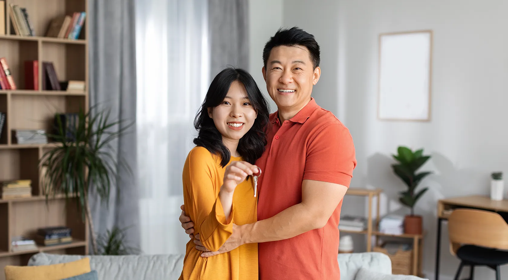 Couple standing in their new home