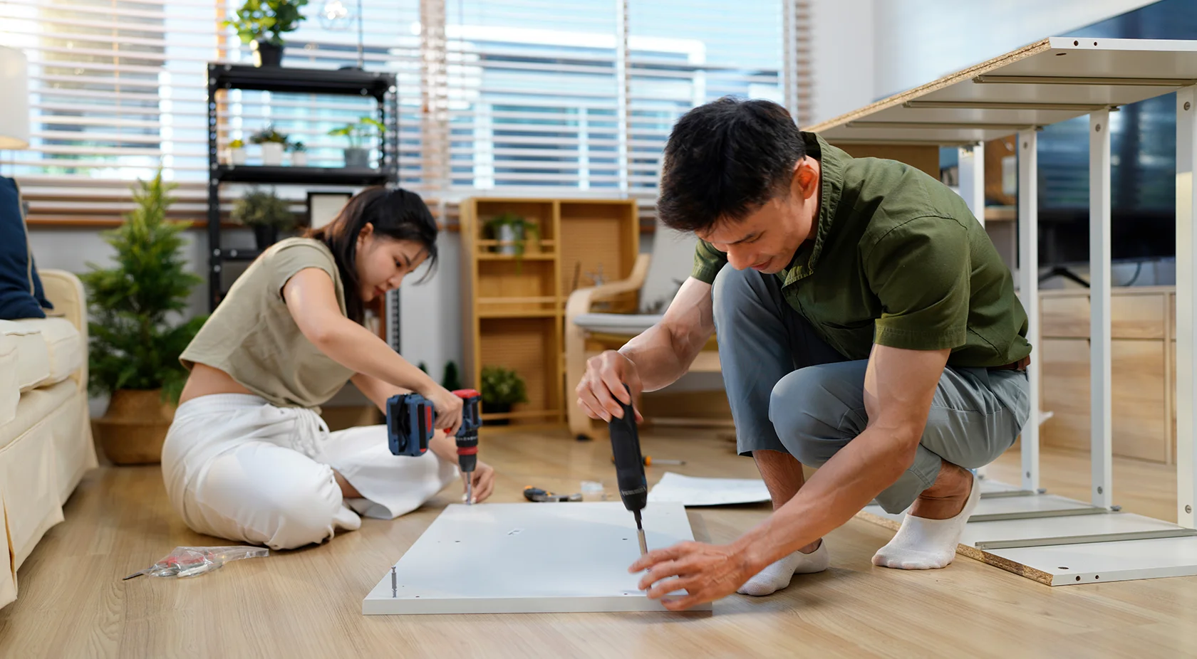 Couple building furniture