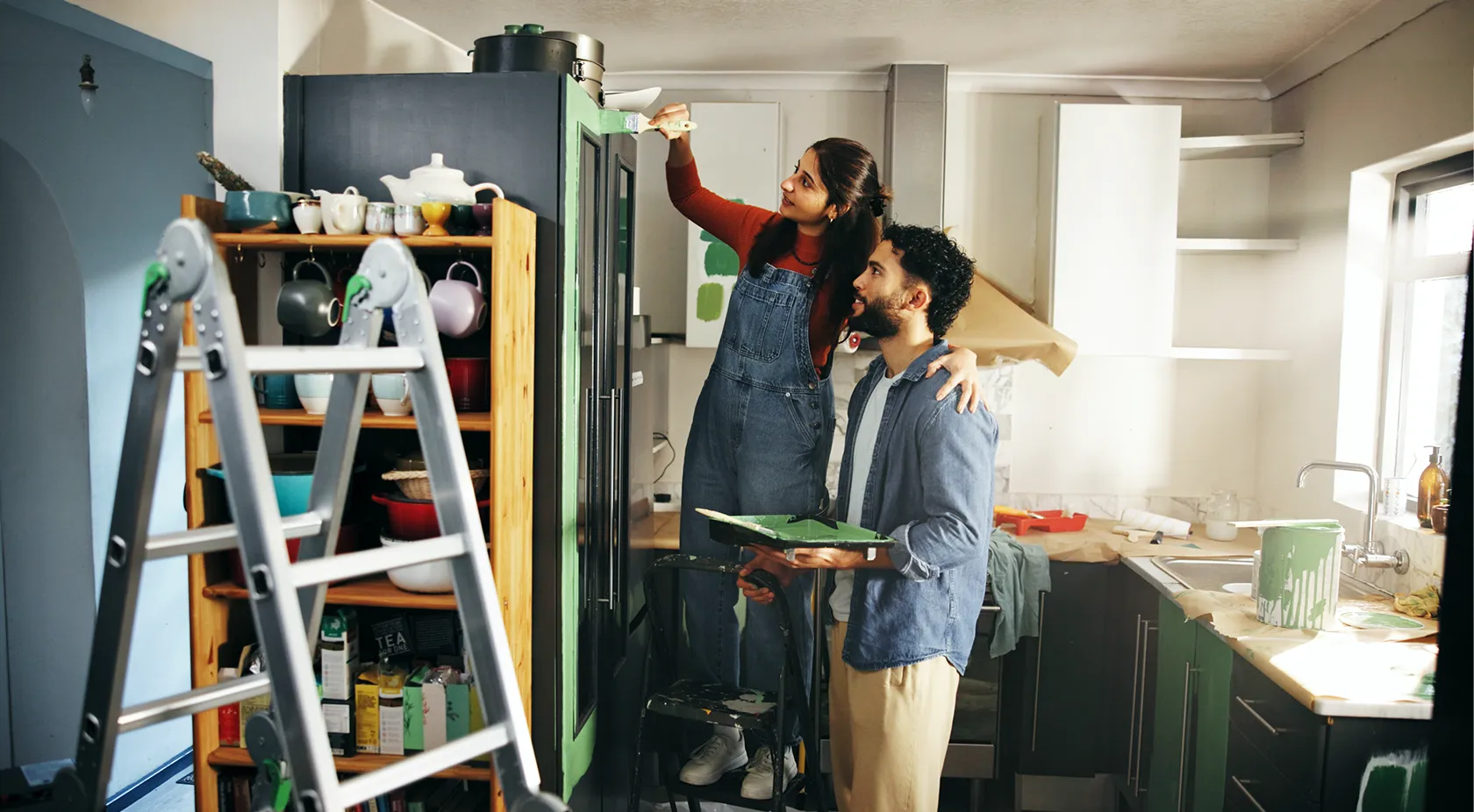 Couple paining their house