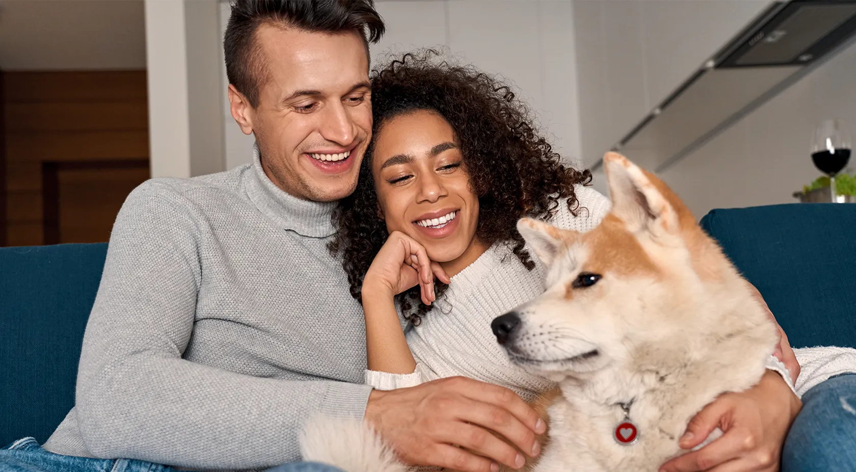 Couple on couch with their dog