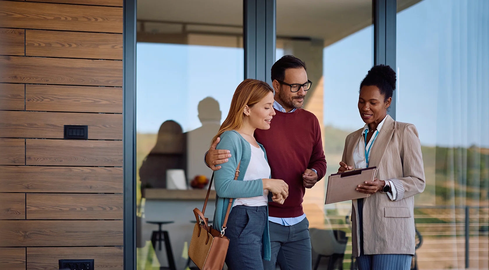 Couple speaking to realtor