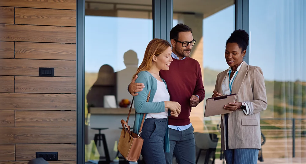 Couple speaking to realtor