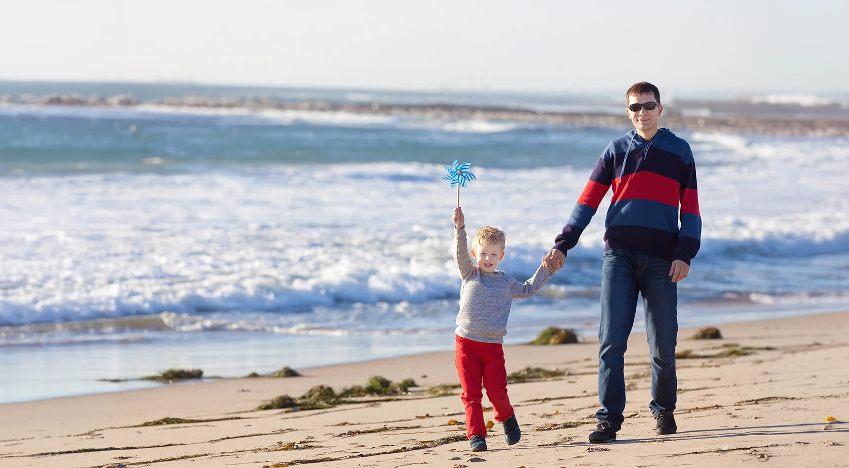 father and son at the beach