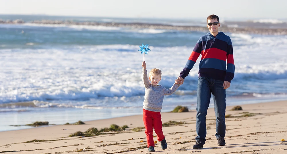 father and son at the beach