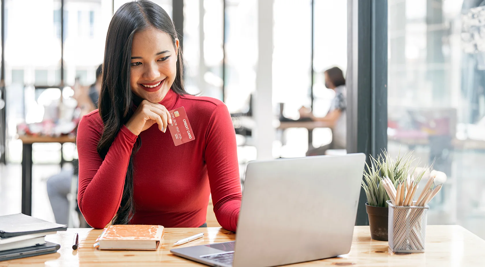 Woman smiling on laptop