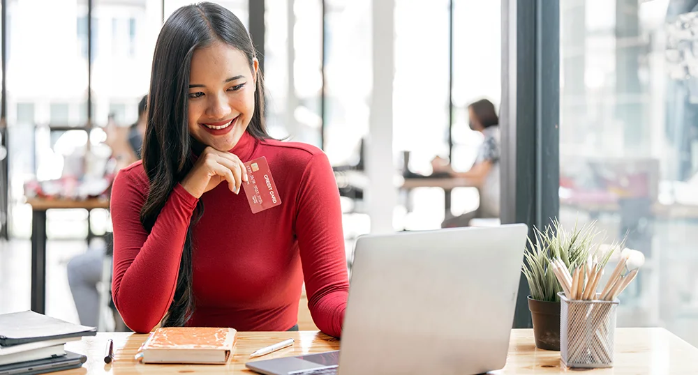 Woman smiling on laptop