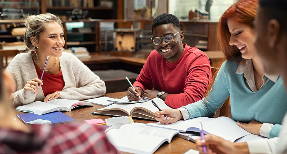 Group of students doing homework together
