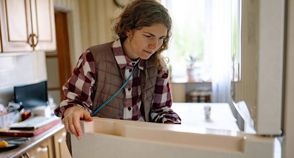 Woman looking into fridge