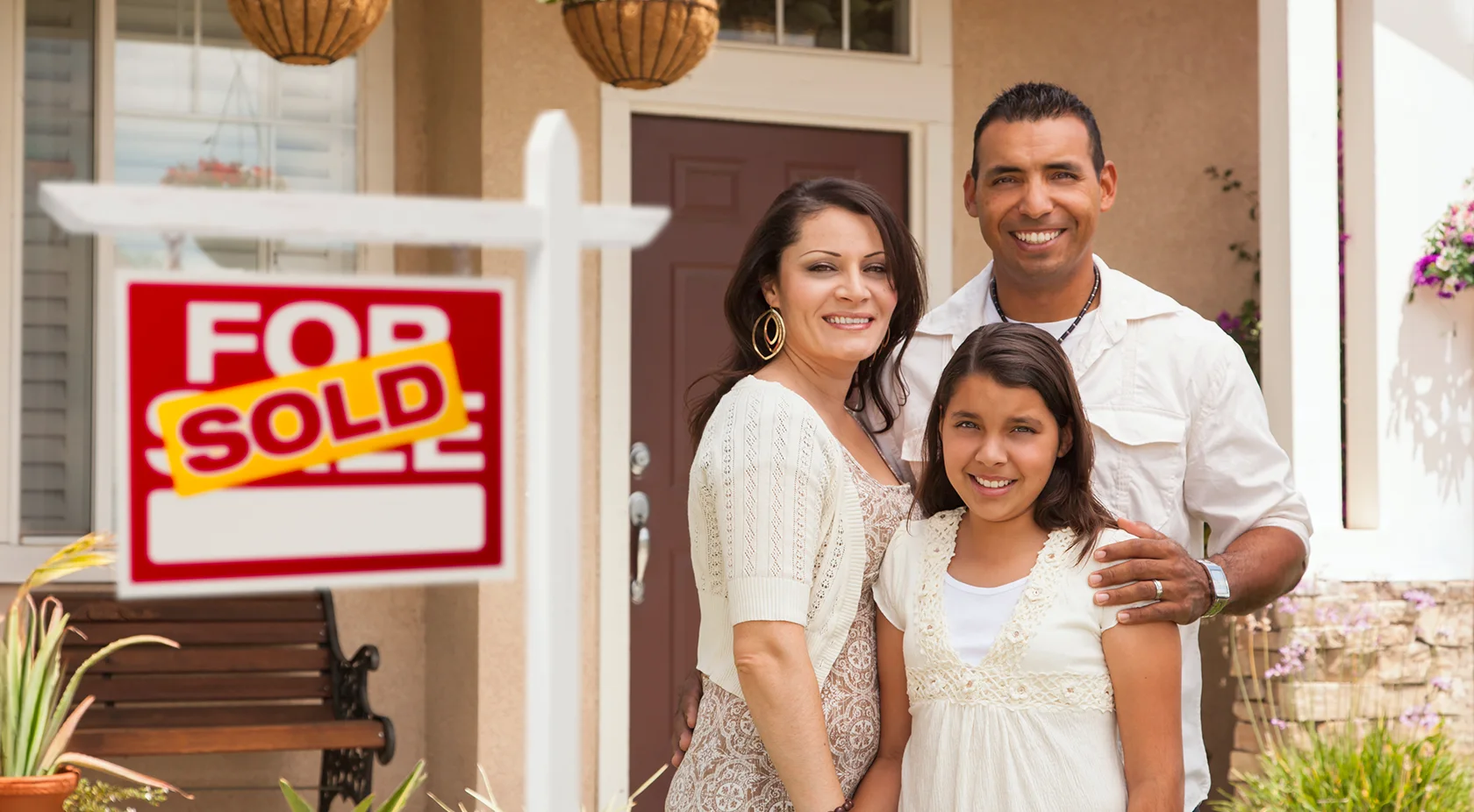 Family in front of new home