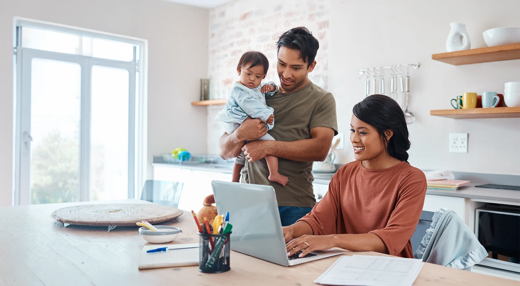 Family looking at laptop