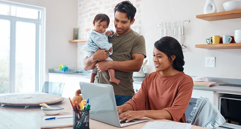 Family looking at laptop