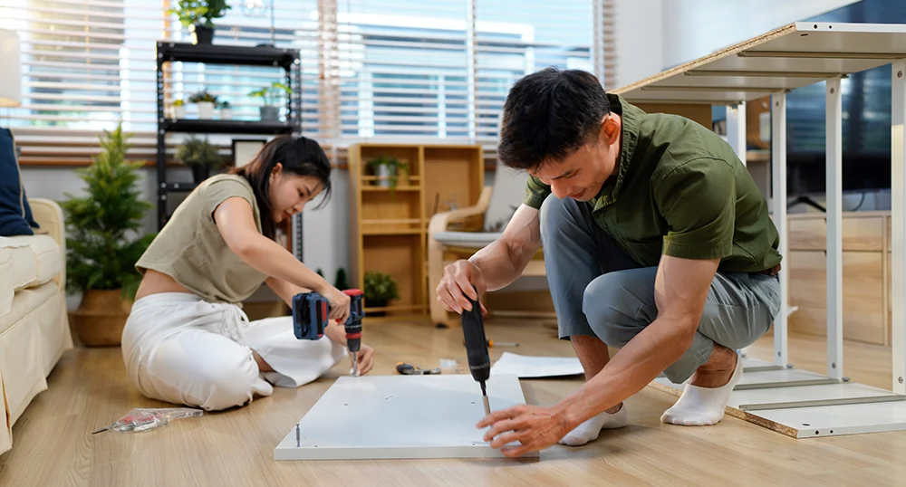 Couple building furniture