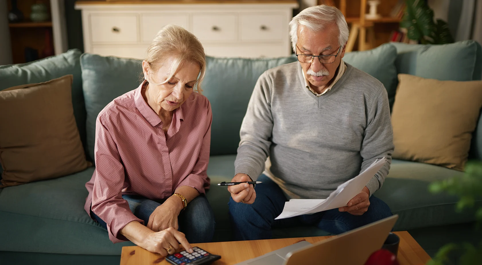 Elderly couple calculating loan