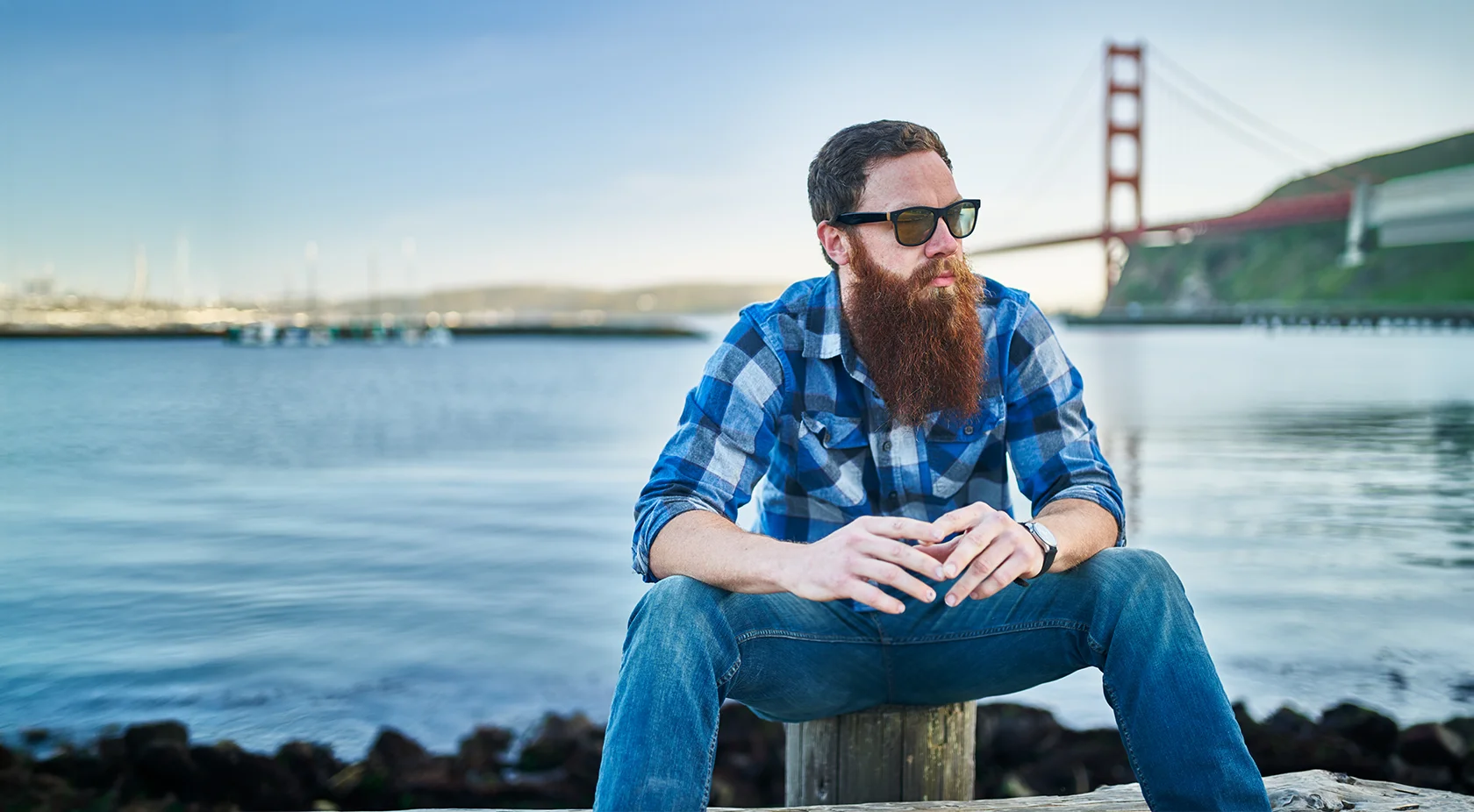 Man sitting by the bay