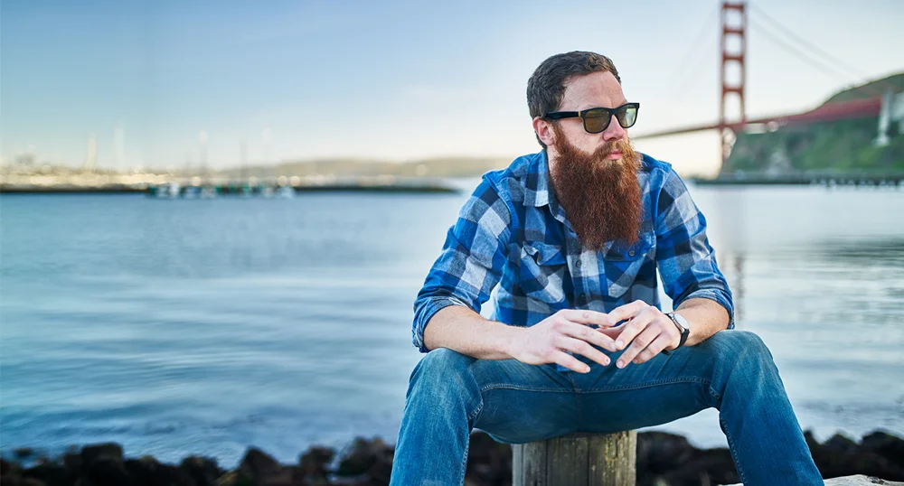 Man sitting by the bay