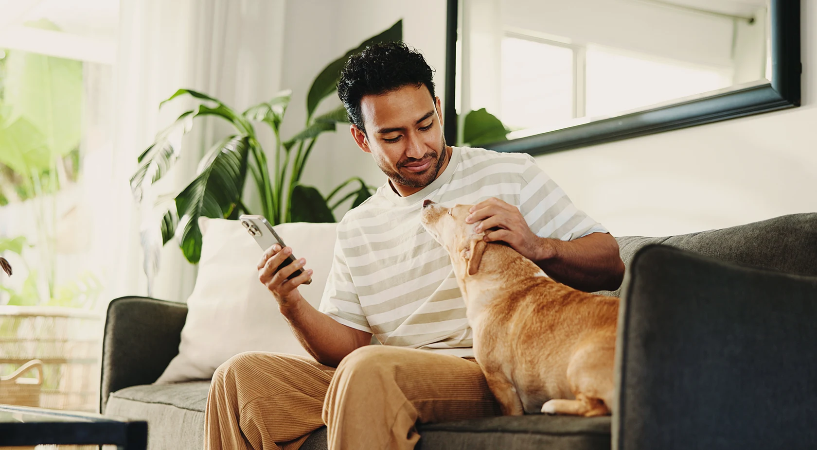 Man petting his dog