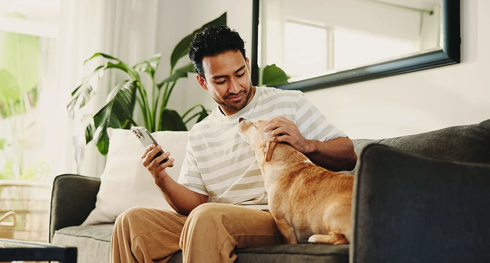 Man petting his dog