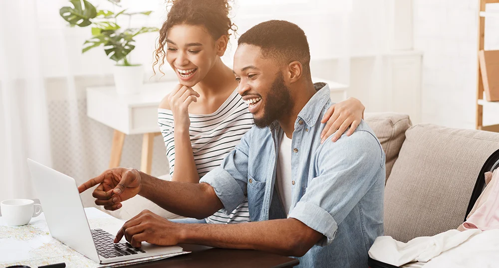 couple happy on laptop