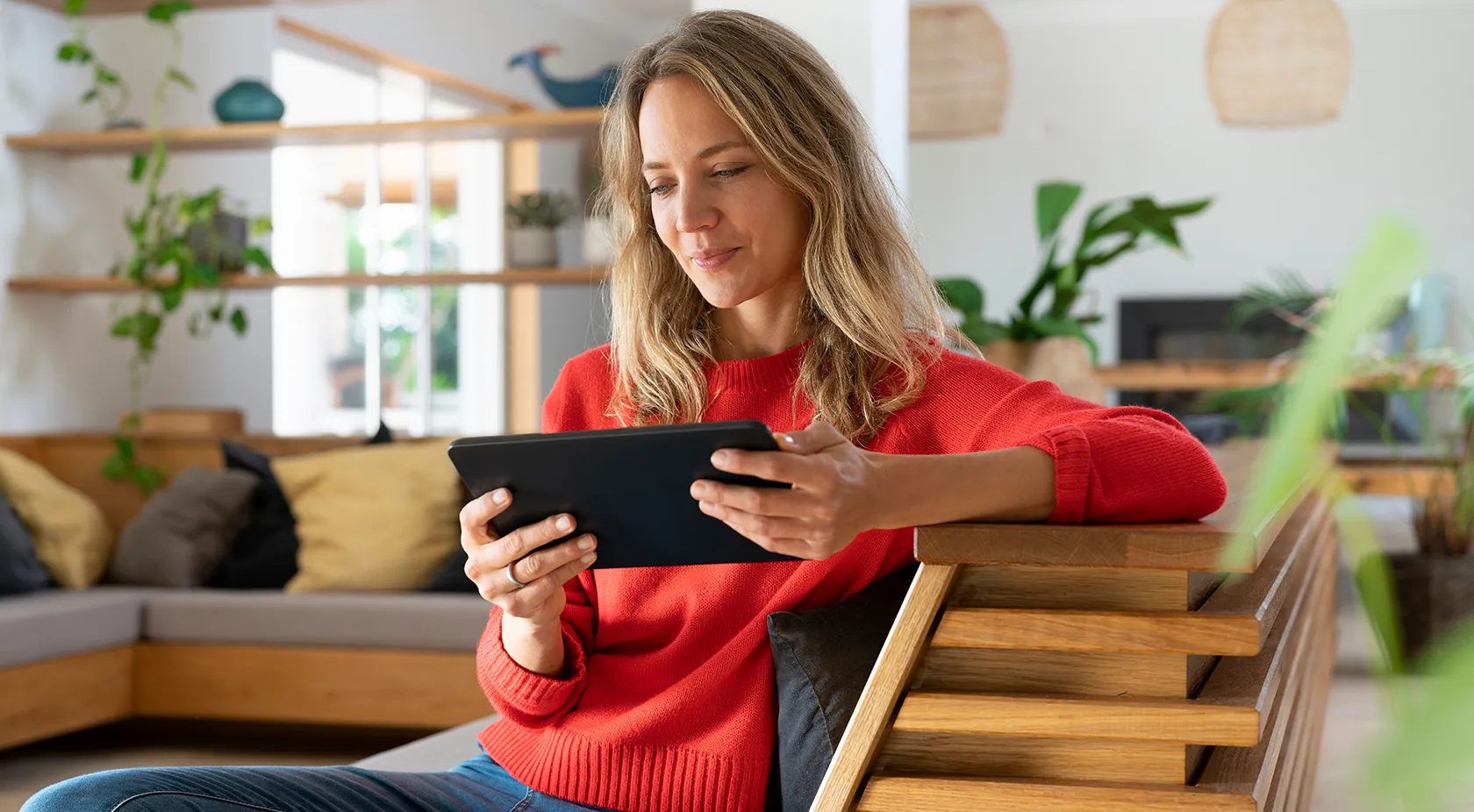 Lady looking at her tablet