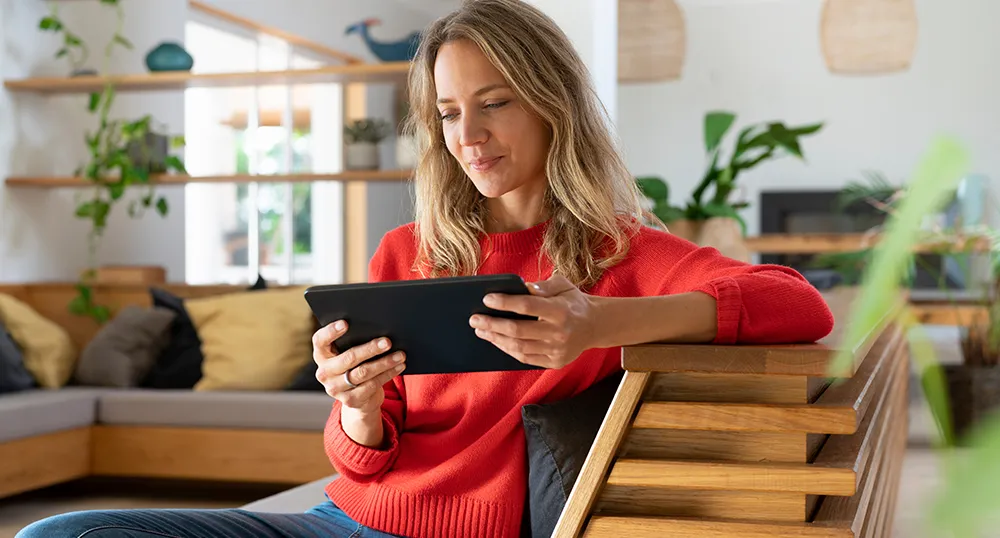 Lady looking at her tablet