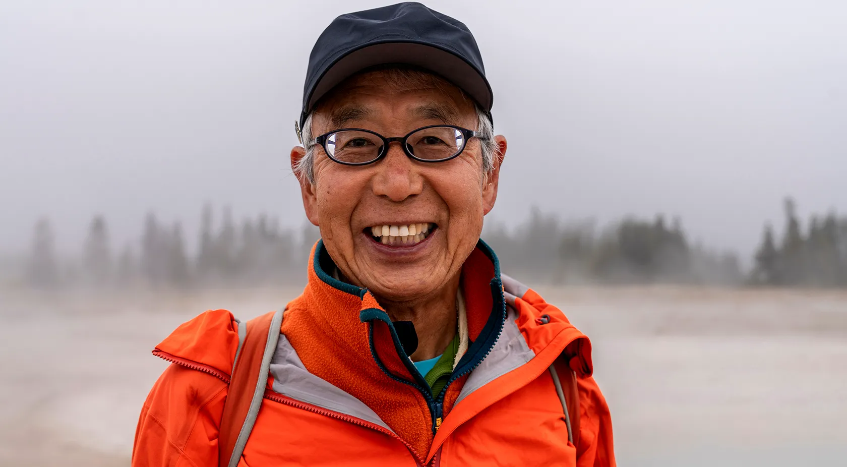 Man smiling while out hiking