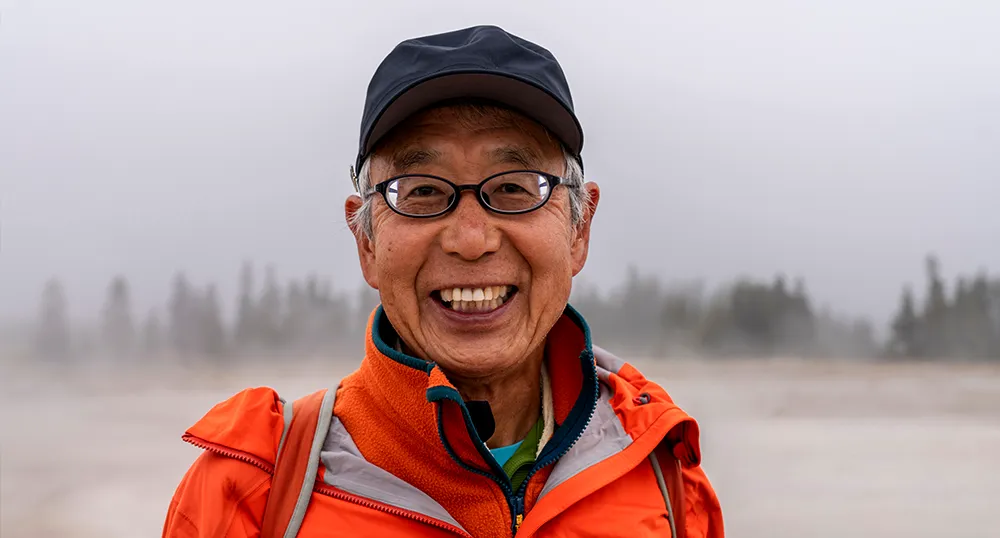 Man smiling while out hiking