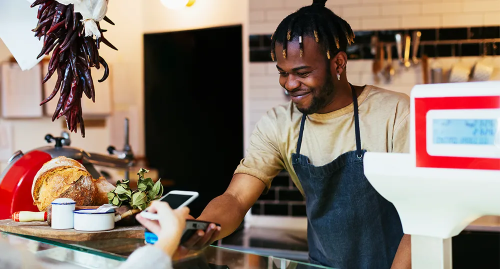 Business owner taking digital payment