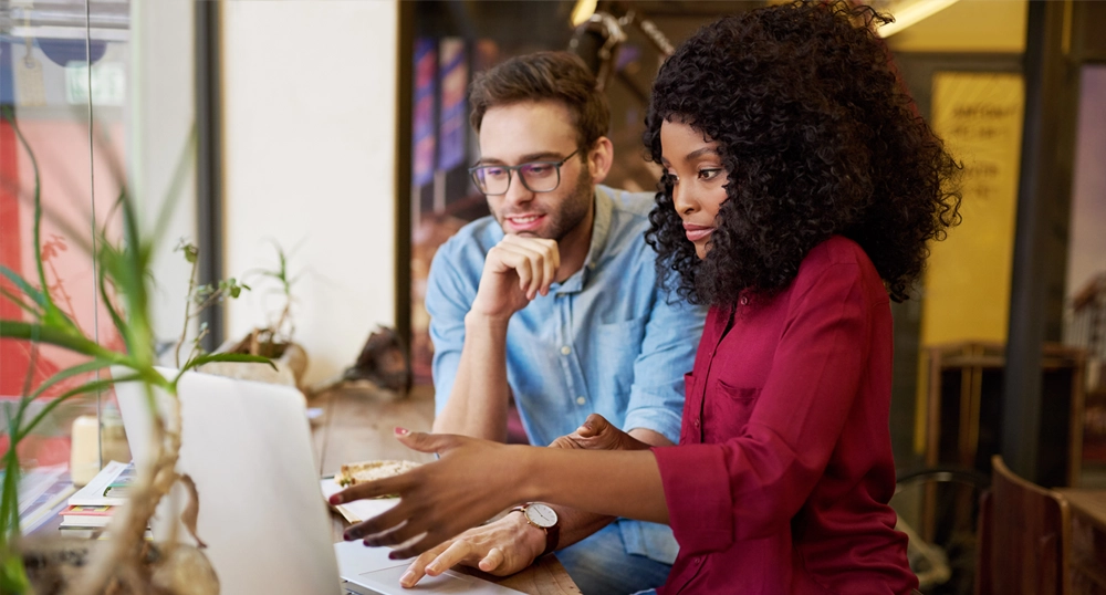 man and woman at laptop