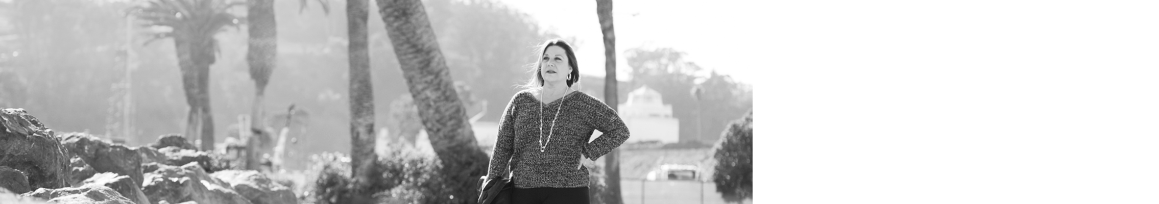 Woman stands with hand on hip on Treasure Island
